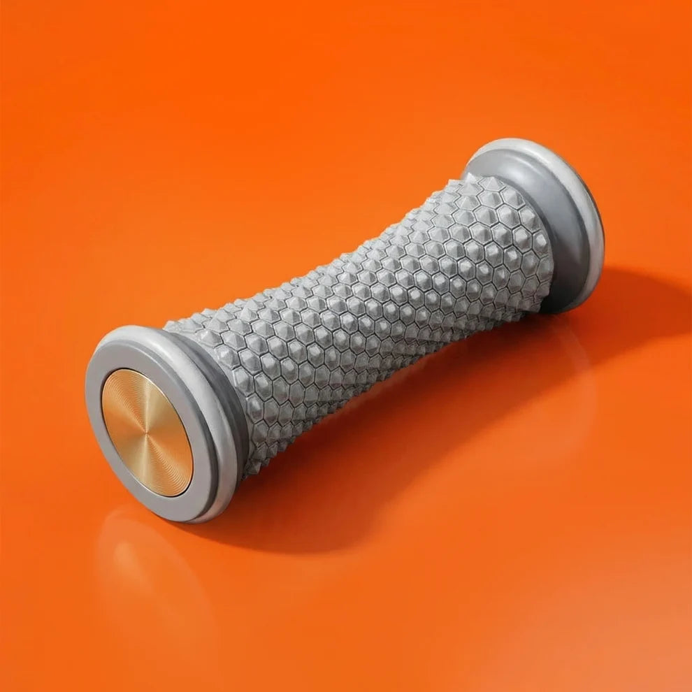Gray Stepup Foot Massage Roller lying on an orange surface